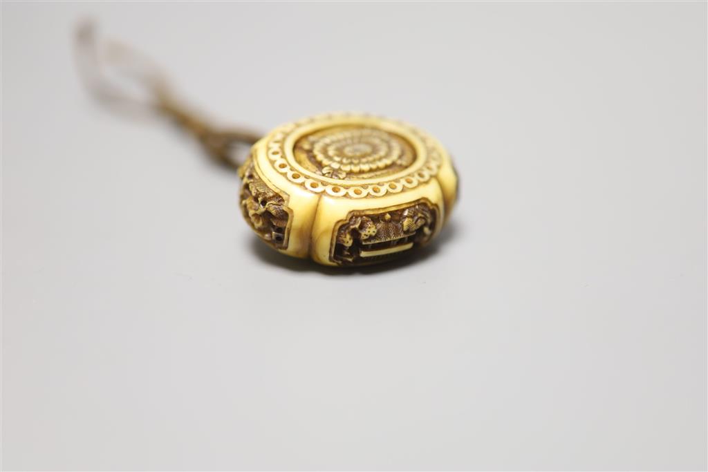 A 19th century ivory manju netsuke